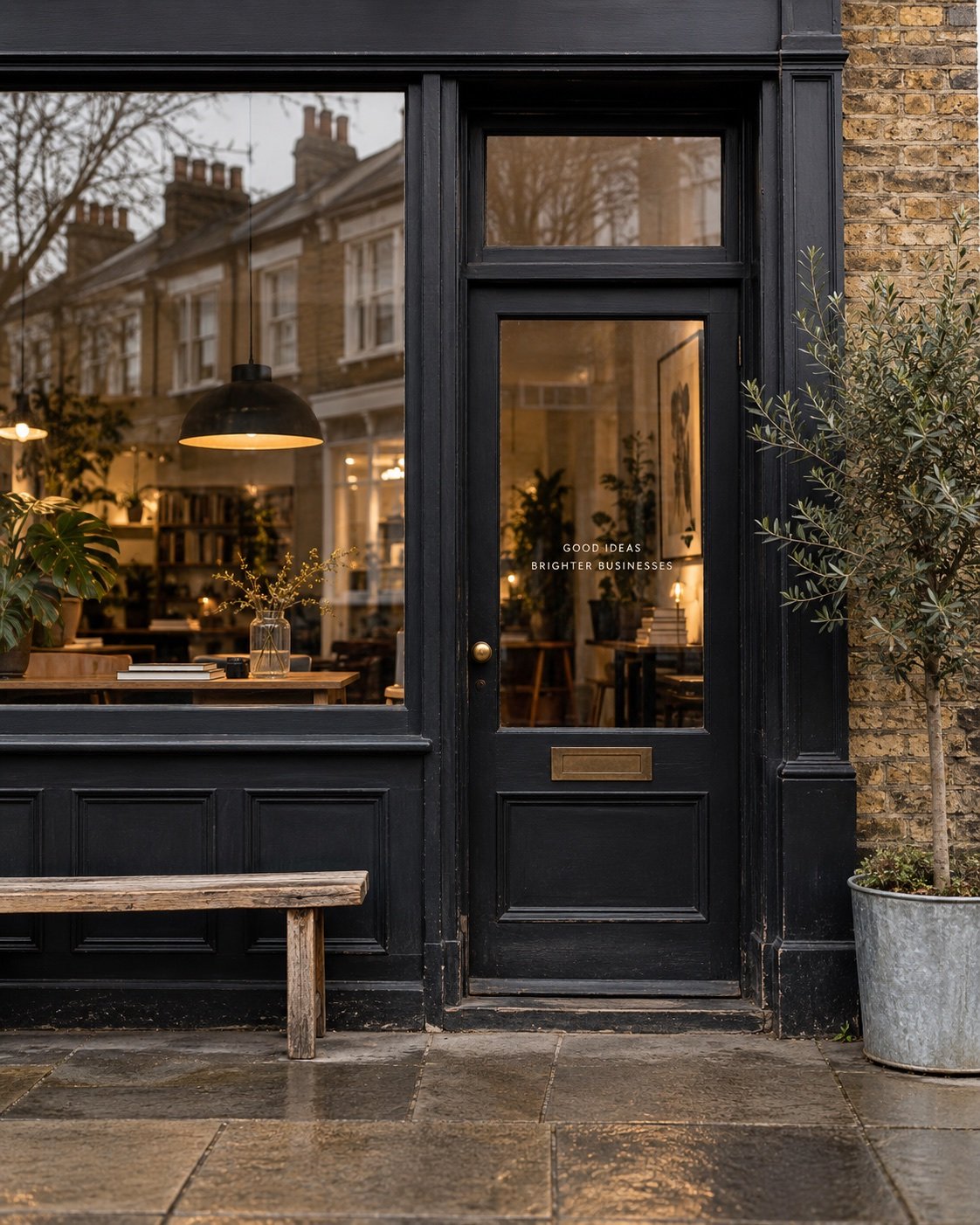 Illustrative local shopfront with warm interior lighting